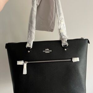 New never opened coach black tote with silver accents